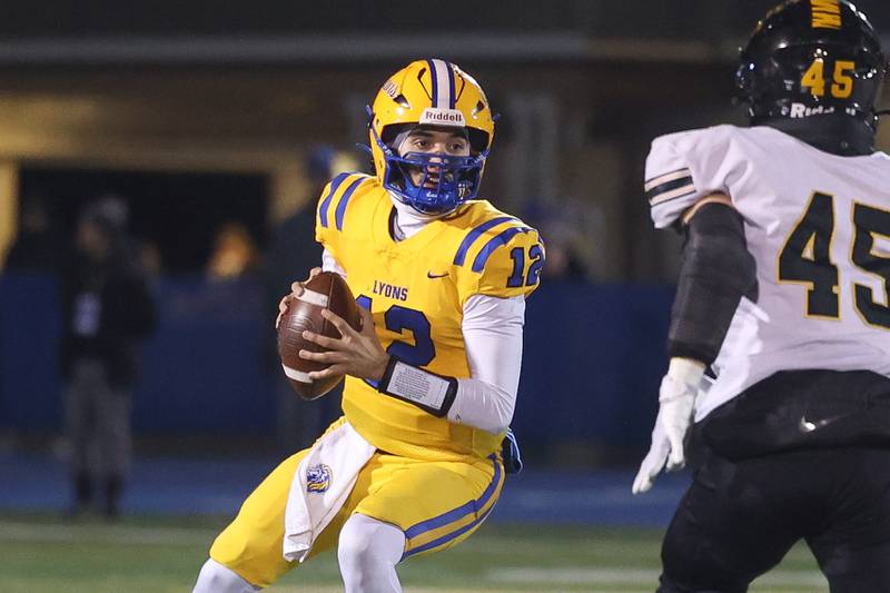 Lyons Township’s Dom Biscotti looks to pass against Joliet West in the first round of the playoffs on Friday, Nov. 1, 2024 in La Grange.