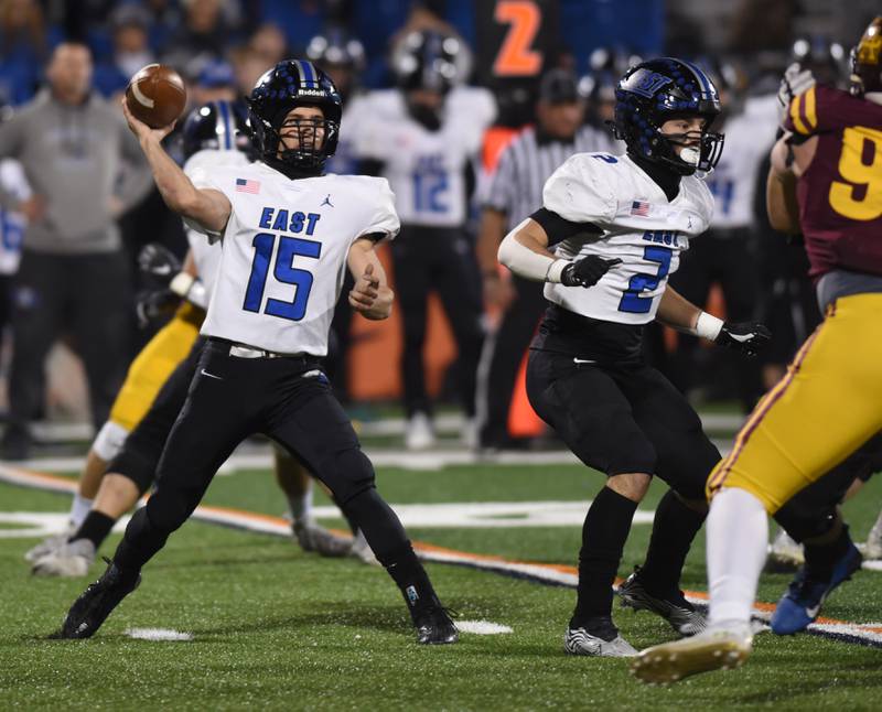 Lincoln-Way East quarterback Braden Tischer throws a pass against Loyola during the Class 8A football state title game at Memorial Stadium in Champaign on Saturday, Nov. 26, 2022.