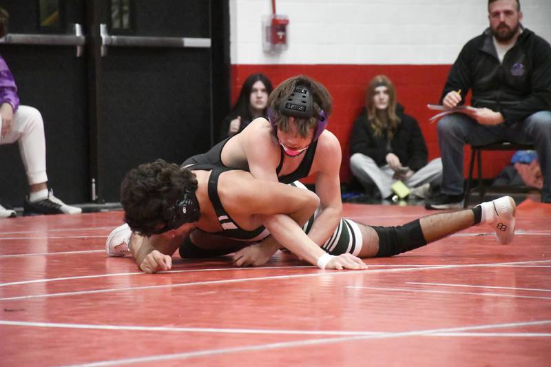 Manteno's Carter Webber pins down Bishop McNamara's Evan Johnson during the All-City wrestling meet on Wednesday, Dec. 3, 2025.
