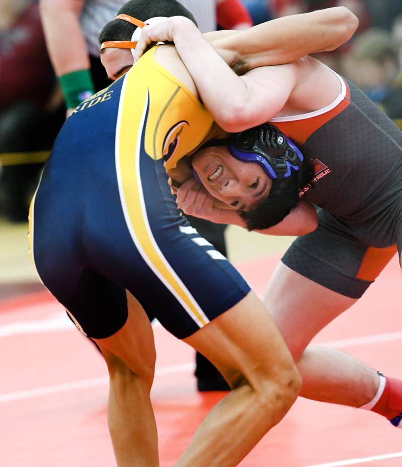 Polo's Lucas Nelson tries to break a hold by Woodstock Marian's Kaden Harman during a 126-pound match at the 1A Oregon Wrestling Sectional on Friday night.