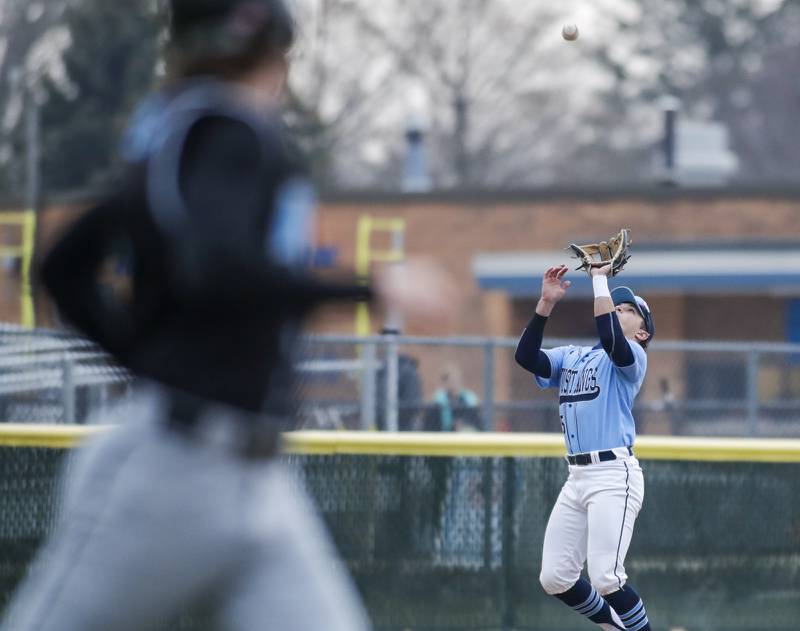 Downers Grove South’s Anthony Titone tracks down a pop fly against Willowbrook during a game in Downers Grove on Tuesday, April 5, 2022.