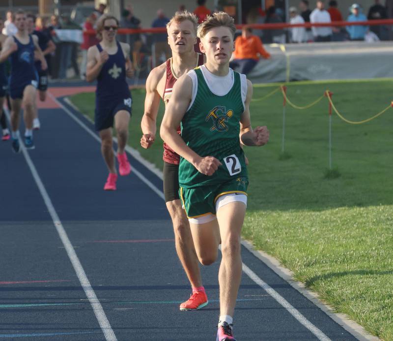 Coal City's Nick Pfeiffer pulls in front of Morris's Nikita Hovious to win the 800 meter run during the Class 2A Sectional on Wednesday, May 20, 2026 at Pontiac High School.