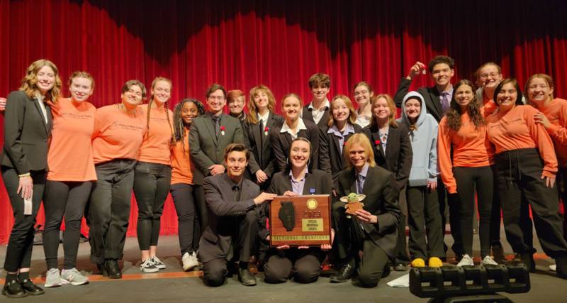 The Yorkville High School speech team poses with their Sectional Champion plaque at DeKalb High School on Feb. 11, 2023.  The YHS speech team were defending champions going into the tournament.