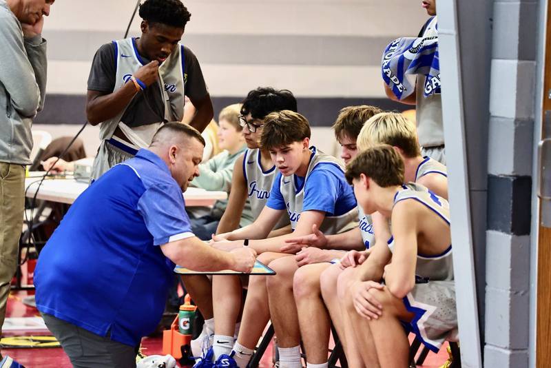 Princeton coach Jason Smith diagrams a play during a timeout in Thursday's JV game at PCA's Howard Hoffman Memorial Gymnasium.