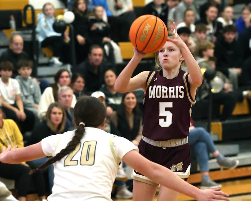 Morris' Ava Petersen shoots over Sycamore's Callie Countryman during their game Tuesday, Jan. 13, 2026, at Sycamore High School.