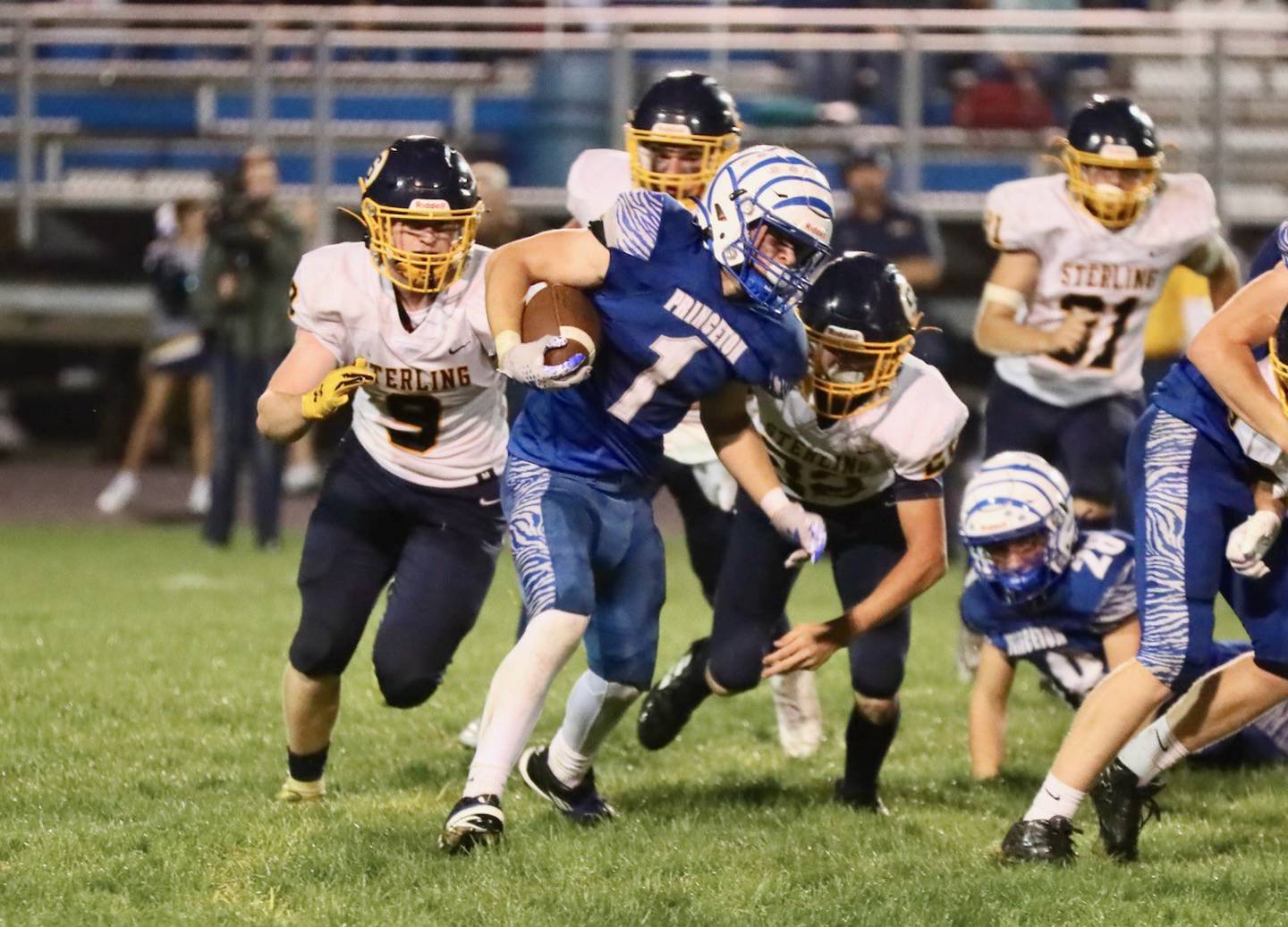 Princeton's Casey Etheridge navigates through traffic in Friday's game vs. Sterling. He scored three touchdowns to lead the Tigers to their first win over Sterling in 95 years.