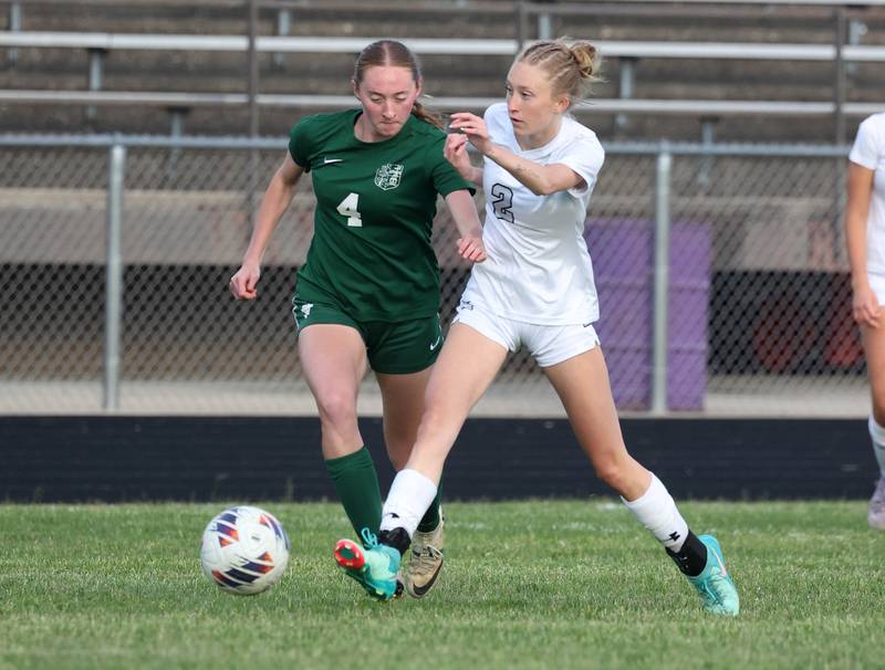 Kaneland's Hannah Boyer (right) kicks the ball away from Boylan's Zoey Schmidt Wednesday, May 28, 2025, during their Class 2A sectional semifinal game at Belvidere High School.