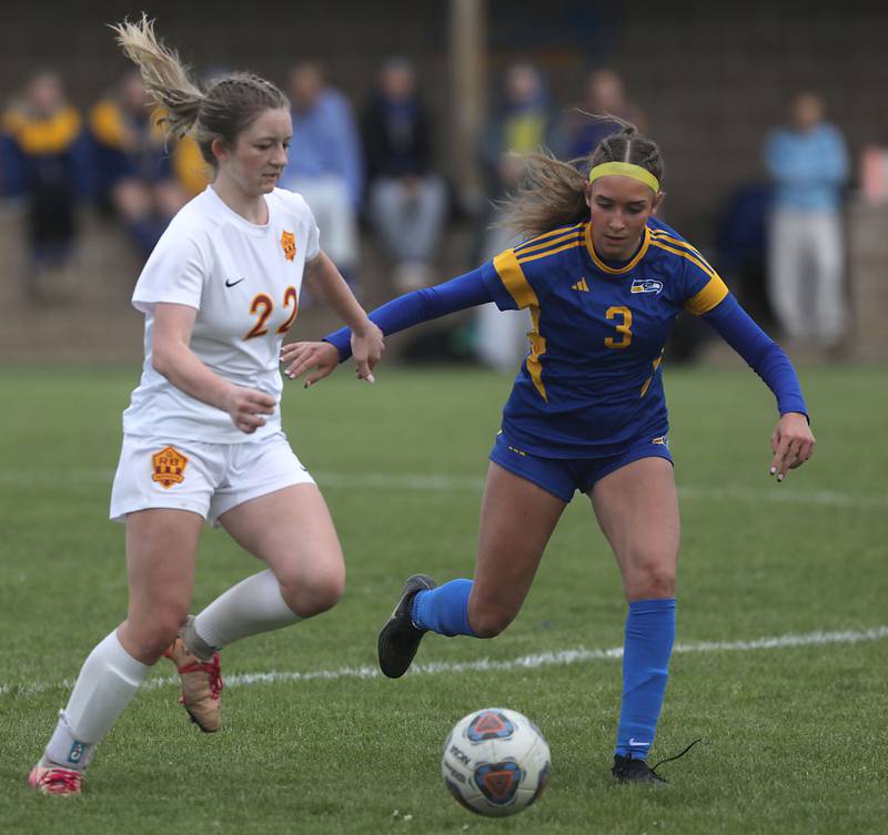 Richmond-Burton's Abigail Leslie tries to beat Johnsburg's Charlie Eastland to the ball during the Kishwaukee River Conference Girls Soccer Tournament Championship match on Wednesday, May 6, 2026, at Johnsburg High School.