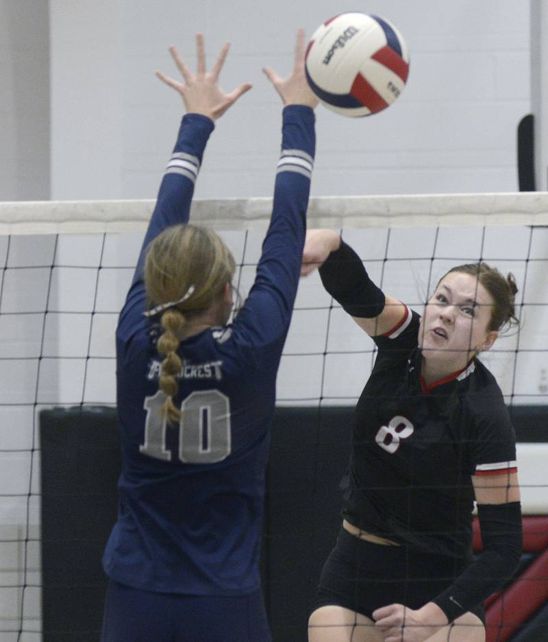 Woodland’s Grace Longmire gets this spike past the block attempt of Fieldcrest’s Jersey Modro in the 1st set Tuesday of Tuesday’s Sub-Sectional match at Woodland.