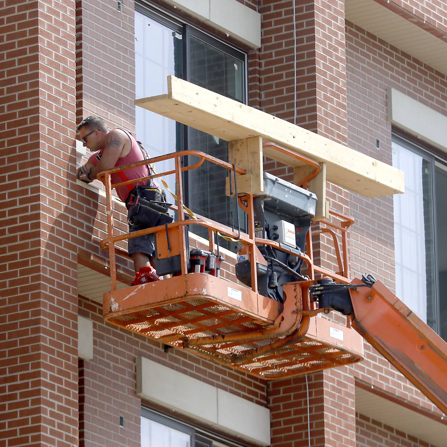 Work continues Wednesday, June 7, 2023, to finish the new building at 11808 Coral St. in Huntley. The building is mixed use with retail and restaurant space on the first floor and residential space on the upper floors.