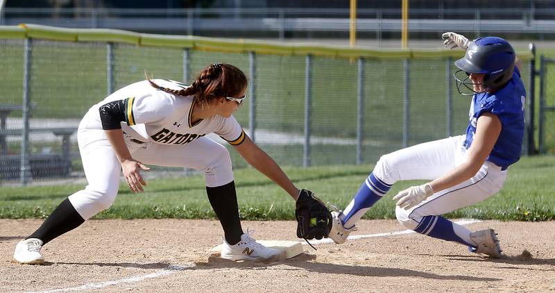 Crystal Lake South's Stephanie Lesniewski tries to tag Burlington Central's Alyssa Becker during a Fox Valley Conference softball game Monday, May 16, 2022, between Crystal Lake South  and Burlington Central at Crystal Lake South High School.