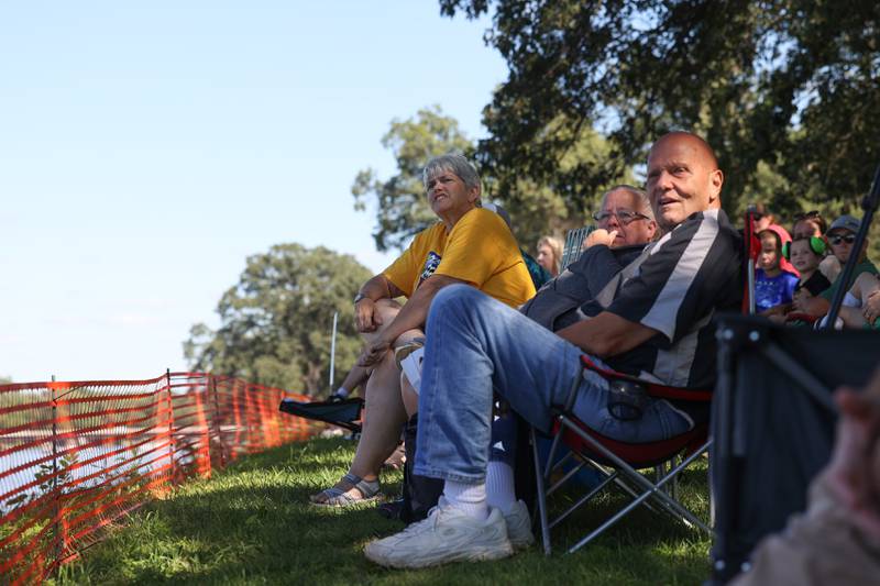Laura Swan, left, a Kankakee native now of Crystal Lake, and Steven and Carolyn Kay, of St. Charles, watch the boat races Sunday, Aug. 31, 2025, during the Kankakee River Valley Regatta. Swan has been attending the event since 1999 and Steven Kay said he has never missed a regatta on the Kankakee River.
