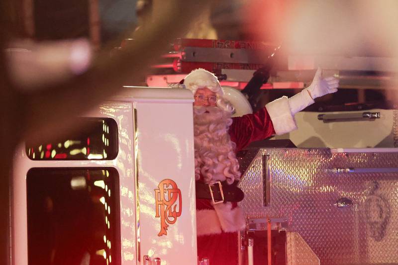 Santa arrives on a Plainfield Fire Department truck at Plainfield’s holiday kickoff Grinchmas on the Green on Saturday, Dec. 5, 2025 in Plainfield.