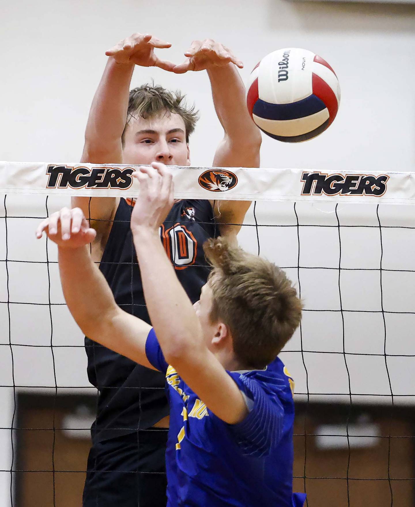 Wheaton Warrenville South's Simon Bratt (10) blocks a Wheaton North shot during the crosstown boys volleyball match Tuesday, April 28, 2026 in Wheaton.
