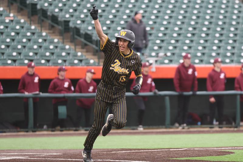 Joliet West’s Bobby Malinowski celebrates a walk-off single in extra innings against Lockport in the WJOL Don Ladas Memorial baseball tournament championship game on Saturday, April 4, 2026 in Joliet.