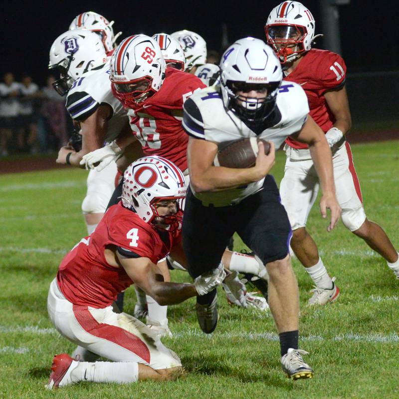 Dixon's Landon Knigge (4) evades Oregon's Jakobi Donegan (4) on Friday, Sept. 26, 2025 at Landers-Loomis Field in Oregon.