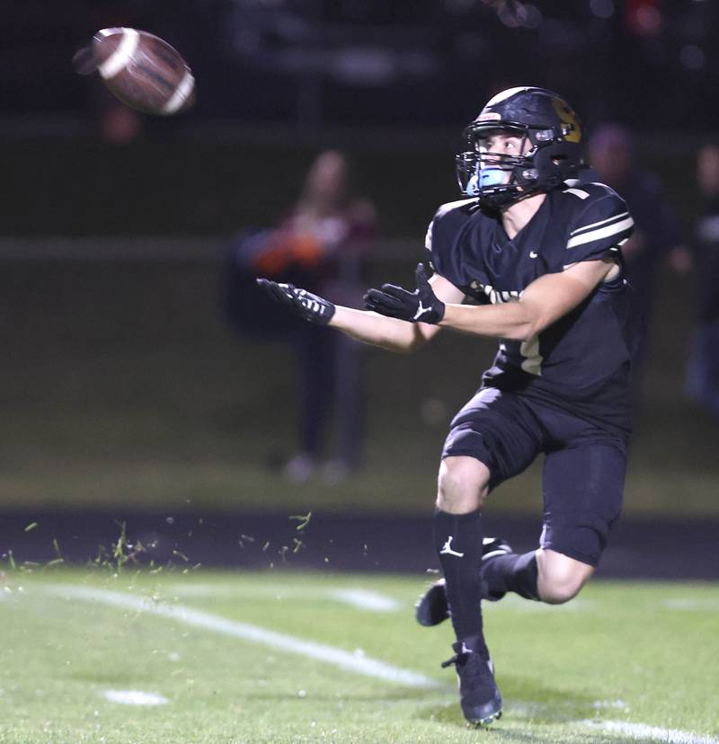 Sycamore's Addison Peck gets behind the Morris defense and hauls in a long pass during their game Friday, Oct. 21, 2022, at Sycamore High School.