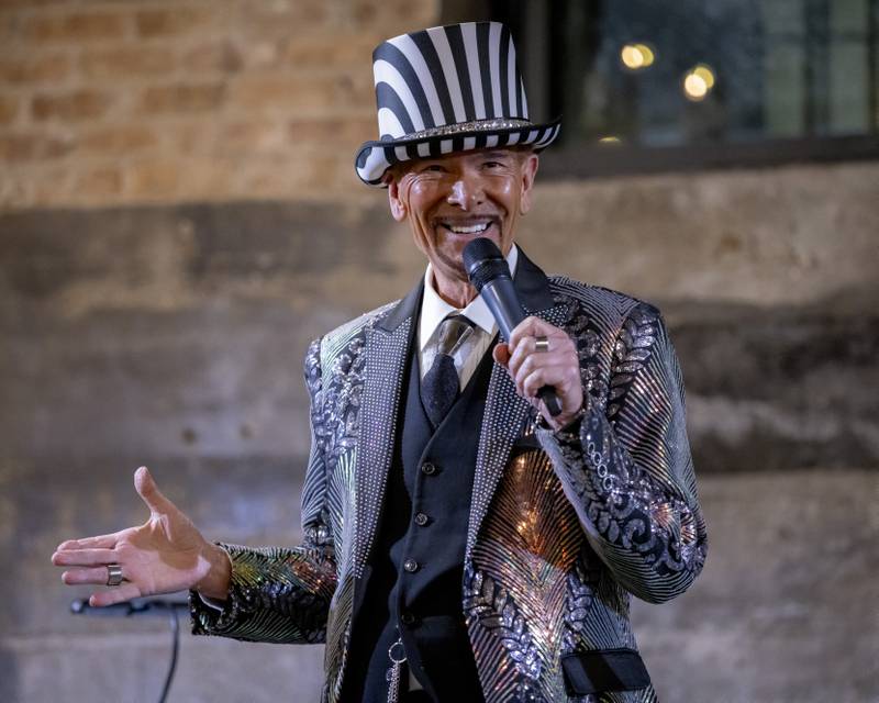 The Mad Hatter and host of the night, Don Zellmer welcomes the crowd of people to the Mad Hatter Ball on January 17, 2024 at the Westclox Event Center.