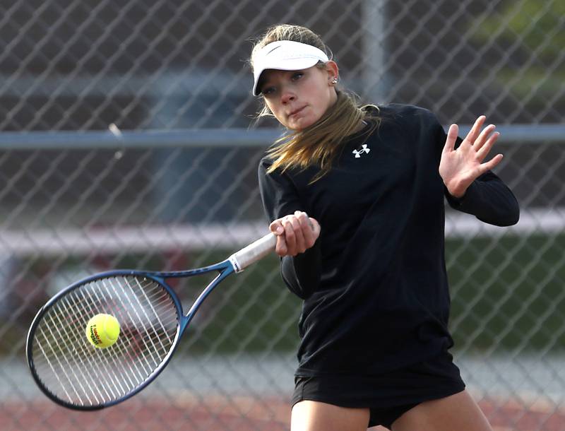 Hinsdale South’s Hinsdale South's Addy Filipiak returns the ball Thursday, Oct. 23, 2025, during the first day of the IHSA State Girls Tennis Tournament at Schaumburg High School.
