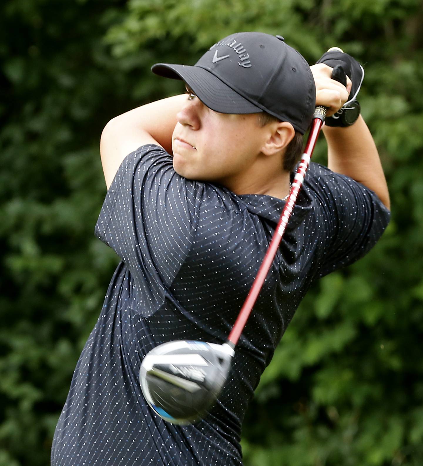 Harvard’s Logan Garafol watches his tee shot on the first hole of the Creekside course Wednesday, July 12, 2022, during the second round of the the McHenry County Junior Golf Association's McHenry County Junior Amateur tournament at Boone Creek Golf Club, in Bull Valley.