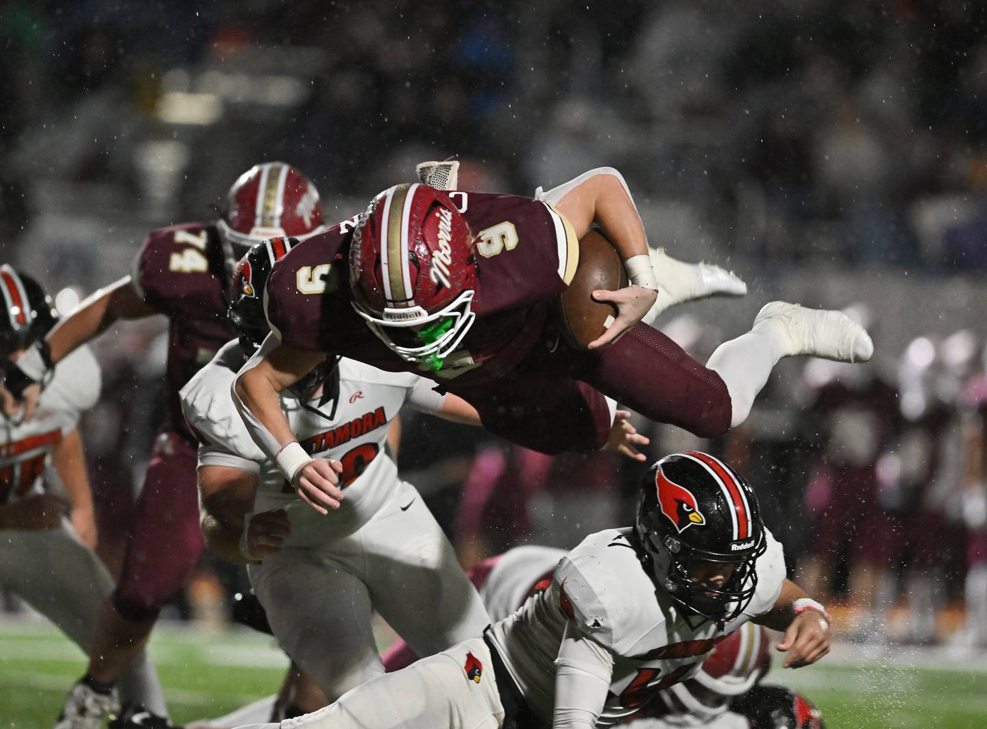 Morris Caeden Curran (9) goes airborne for a first down during the class 4A second round playoff game against Metamora on Saturday, NOV. 08, 2025, at Morris.