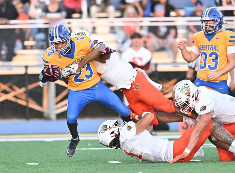 Joliet Central's Dimarius Matthews (23) gets tackled during the conference game against Plainfield East on Friday, SEP. 12, 2025, at Joliet.