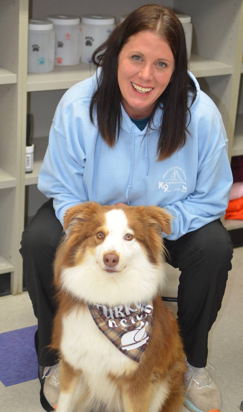 Granny Rose Animal Shelter Executive Director Shannon Eastman poses with Chief, a 3-year-old Australia Shepherd, on Friday, Nov. 17, 2023. Chief is among the dogs and cats up for adoption at the shelter.