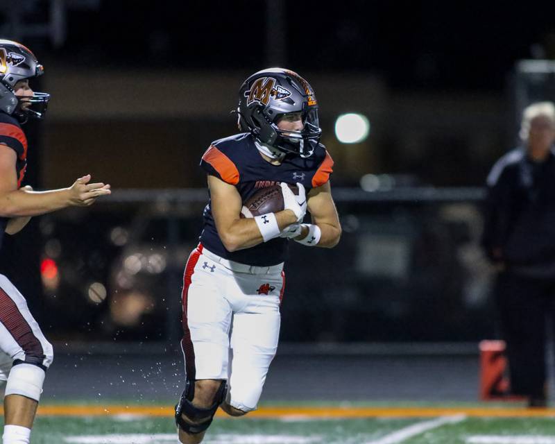 Minooka's Joey Partridge (2) runs with the ball during football game between Plainfield North at Minooka.   Oct 6, 2023.