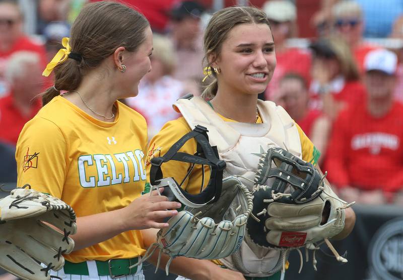 Providence Catholic pitcher Macie Robbins talks with catcher Mia Sanfratello during the Class 3A State finals game on Saturday, June 14, 2025 at the Louisville Slugger Sports Complex in Peoria.
