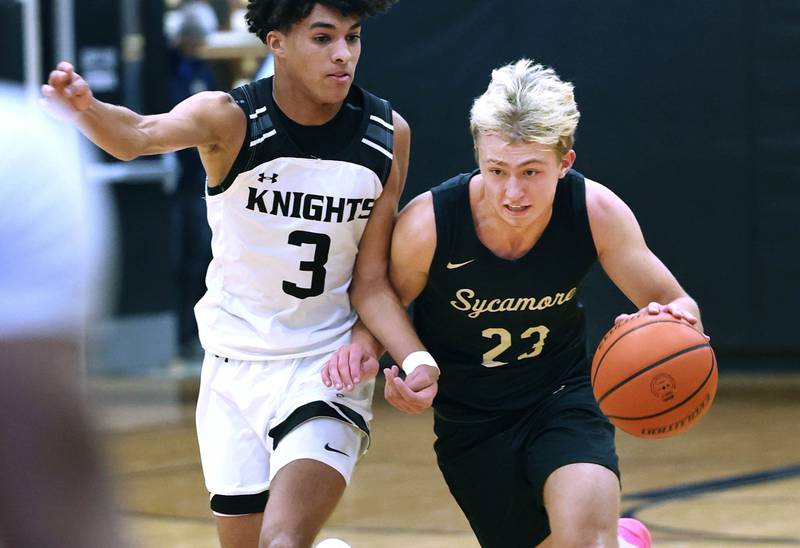 Sycamore's Carter York pushes the ball up court against Kaneland's Evan Frieders during their game Friday, Jan. 5, 2024, at Kaneland High School in Maple Park.
