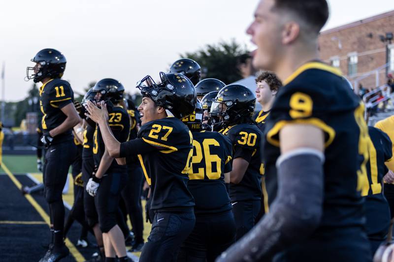 Joliet West players cheer from the sidelines during a varsity football home game against Plainfield South on Sept. 12, 2025.