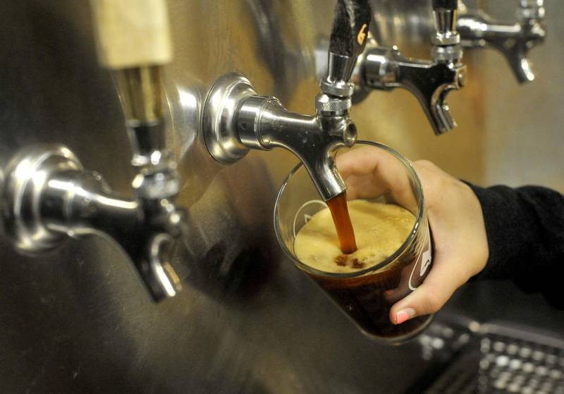 Jordan Kohut pours a beer Saturday, Sept. 29, 2018, at McHenry Brewing Company. The craft brewery is one of the vendors at the Woodstock Ale Fest.