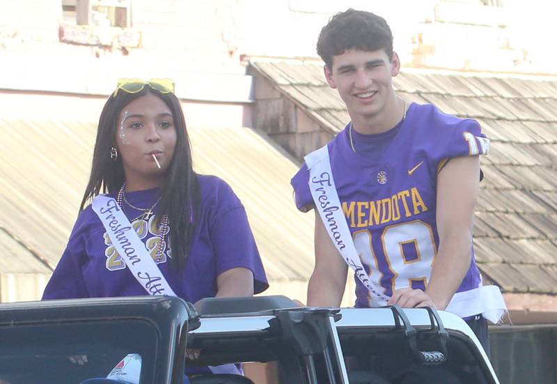 Mendota High School freshman attendants Quinn Eddy and Azaria Morris ride down Indiana Avenue during the homecoming parade on Friday, Oct. 3, 2025