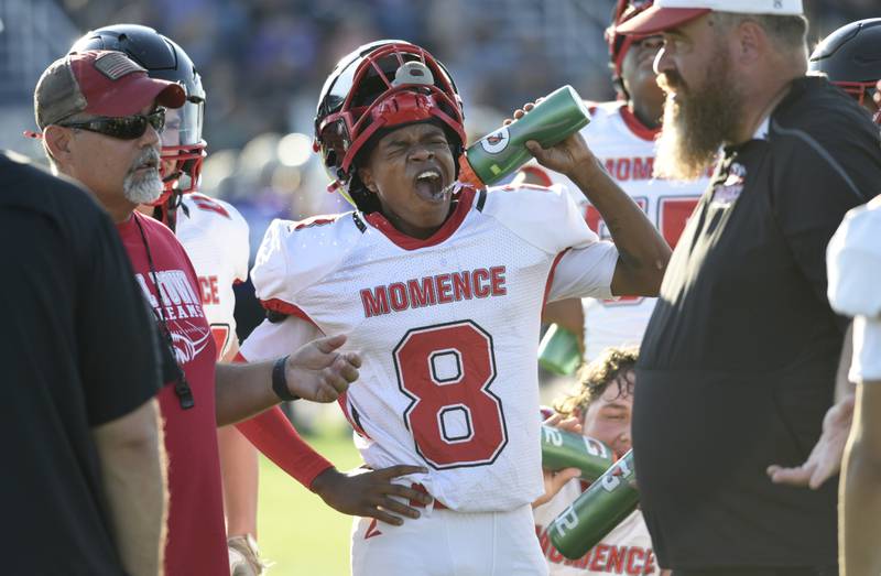 Momence's Marshawn Taylor gets a drink of water during a break in the action against Manteno on Friday, August 22, 2025.