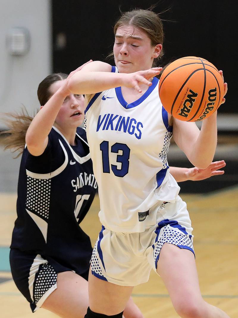 Geneva's Linnea Popp is pressured by St. Viator's Bella Gounaris during the IHSA Class 3A Woodstock North Supersectional girls basketball game on Monday, March 2, 2026, at Woodstock North High School.