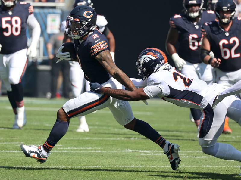 Chicago Bears wide receiver DJ Moore pulls away from Denver Broncos cornerback Damarri Mathis during their game Sunday, Oct. 1, 2023, at Soldier Field in Chicago.