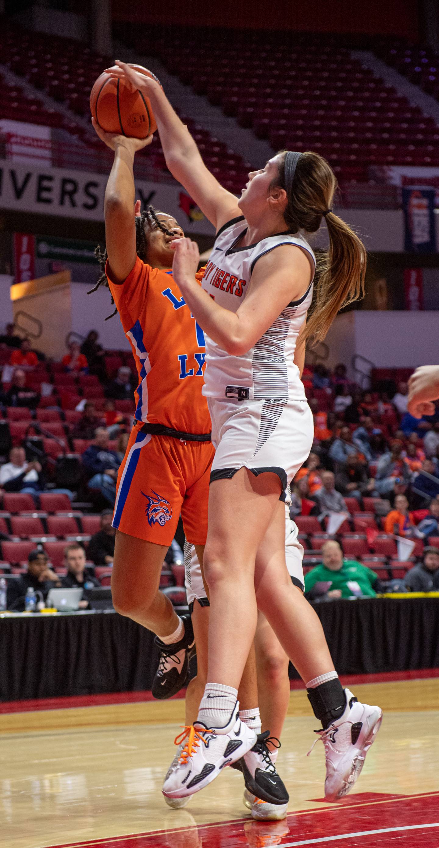 Byron's Brittyn Bielskis (11) blocks a shot by Chicago Butler's Xamiya Walton (1) at the 2A state semifinal game on Thursday.