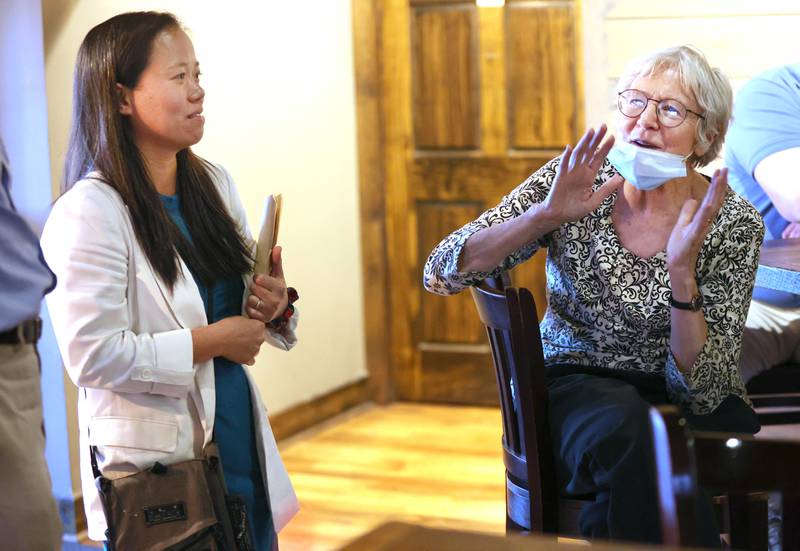 Linh Nguyen, (left) candidate for DeKalb County Clerk and Recorder, talks to Mary Cozad, incumbent candidate for DeKalb County Board District 10, Tuesday, June 28, 2022, during a Democrat candidate watch party at Fatty's Pub and Grille in DeKalb.