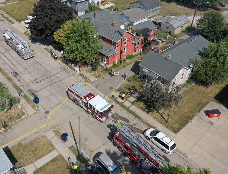 La Salle and Peru firefighters work the scene of a structure fire as smoke emits from the attic from a home in the 300 block of Crosat Street on Thursday, Sept. 19, 2024 in La Salle. The fire happened shortly after 12:30p.m.