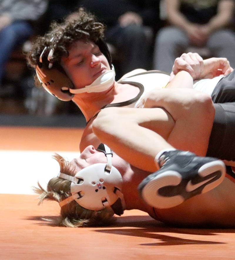 Crystal Lake Central’s Dylan Ramsey, bottom, battles Jacobs’ Gavin Greco at 126 pounds in varsity boys wrestling on Tuesday, Jan. 20, 2026 at Crystal Lake Central High School in Crystal Lake.