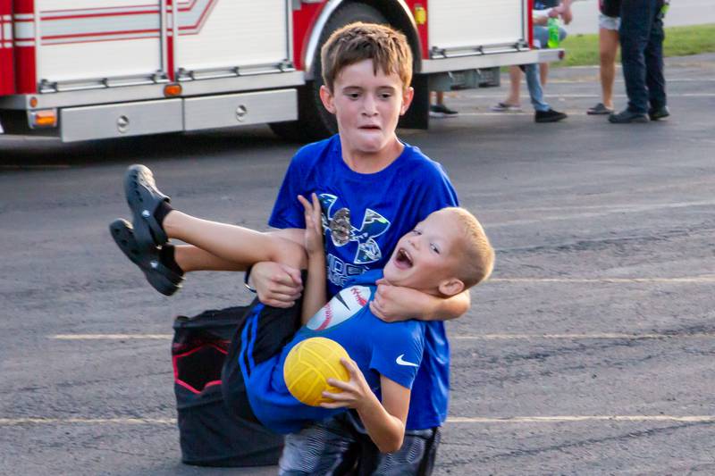 Children play together Friday, Aug. 23, 2024, at Family Safe Night outside of the Mendota Civic Center.