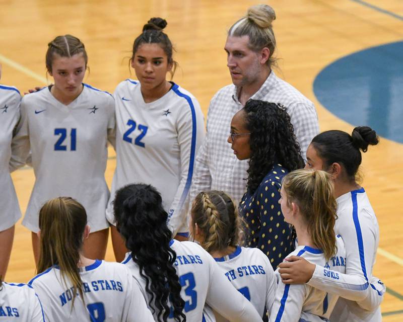 St. Charles North's head coach Lindsey Hawkins talks to the team during a timeout in the first game on Wednesday Oct. 2, 2024, while traveling to take on St. Francis High School in Wheaton.