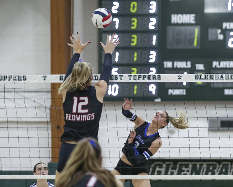 St Charles North's Amber Czerniak (3) goes for a kill during Class 4A Glenbard West Sectional final volleyball match between St Charles North at Benet. Nov 6, 2025 in Glen Ellyn.