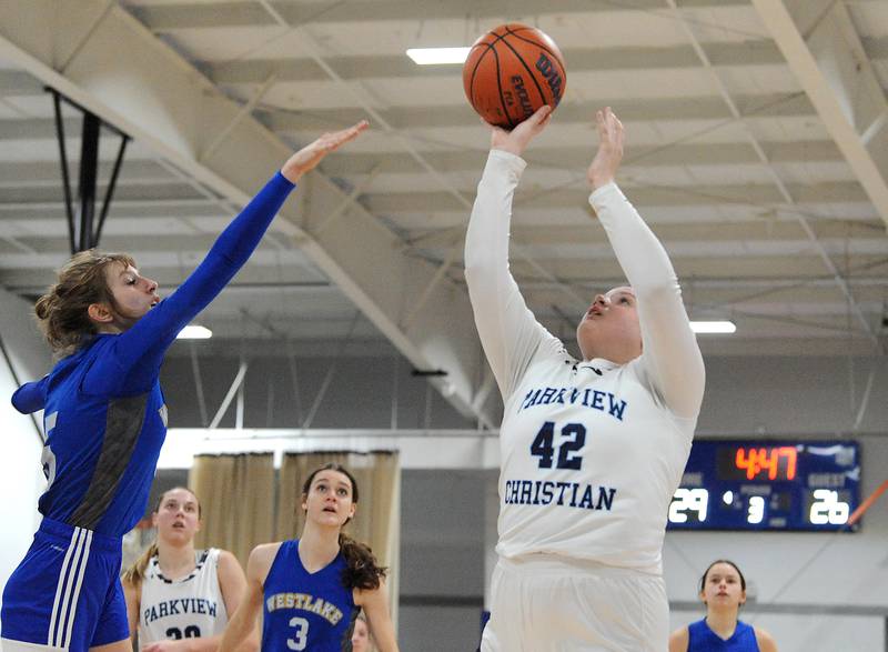 Parkview Christian's Emily Howard (42) puts up a shot over West Lake Christian defender Juliet Sigurnjak (5) during a girls' basketball game at Parkview Christian Acedemy on Tuesday, Dec. 20, 2022.