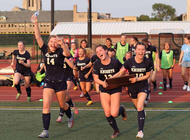 IC Catholic celebrates their victory with the fans after the IHSA Class 1A girls soccer super-sectional match between Richmond-Burton and IC Catholic at Concordia University in River Forest on Tuesday, May 23, 2023.