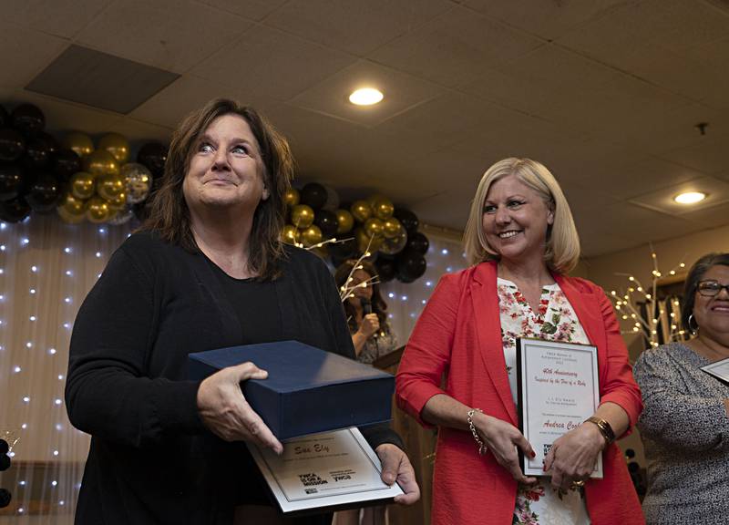 The L.L. Ely Award for Clerical Excellence goes to Sue Ely (left) Thursday, April 13, 2023 at the YWCA Women of Achievement Luncheon.
