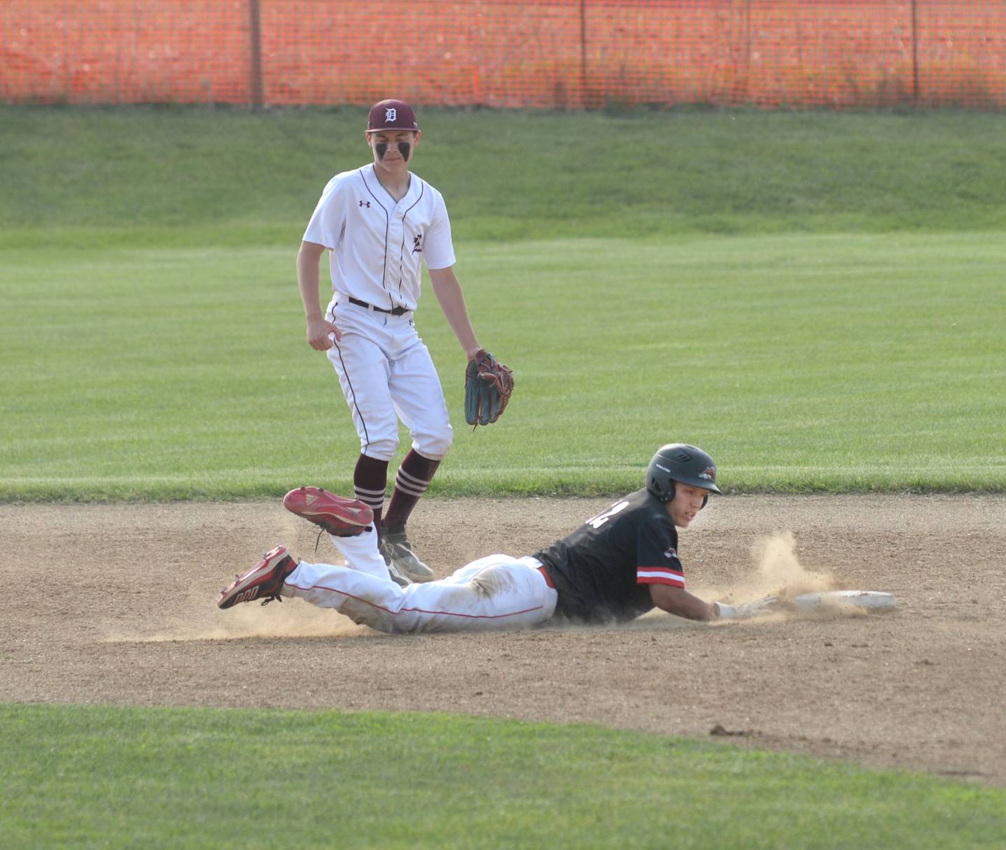 Fulton's Ryan Eads dives back safely to second during afternoon action at the 1A Pearl City Sectional on Wednesday, May 24.