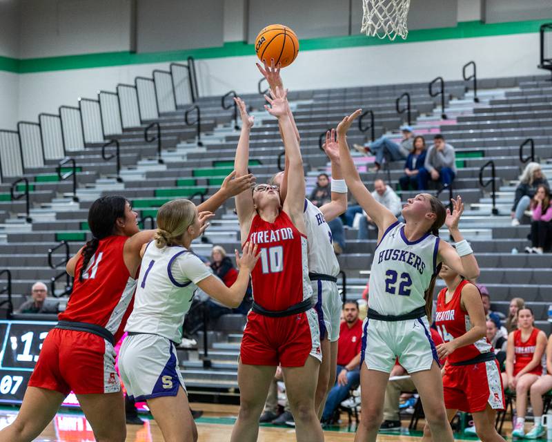 Players from Streator and Serena look for rebound during first round game of the 2025 Falcon-Irish Thanksgiving Tournament on Monday, November 17, 2025 at Seneca High School in Seneca.