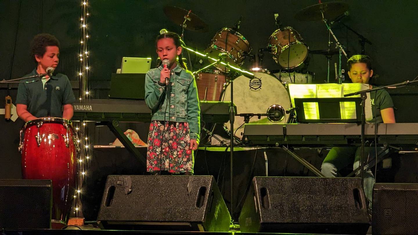 Teddy Hoskins (left), Maica Hoskins (center) and Nora Hoskins (right)perform on Sunday, April 30, 2023 at The Forge in Joliet. They are part of The 815, a nonprofit that gives youth the opportunity to showcase their musical talents on a professional stage.