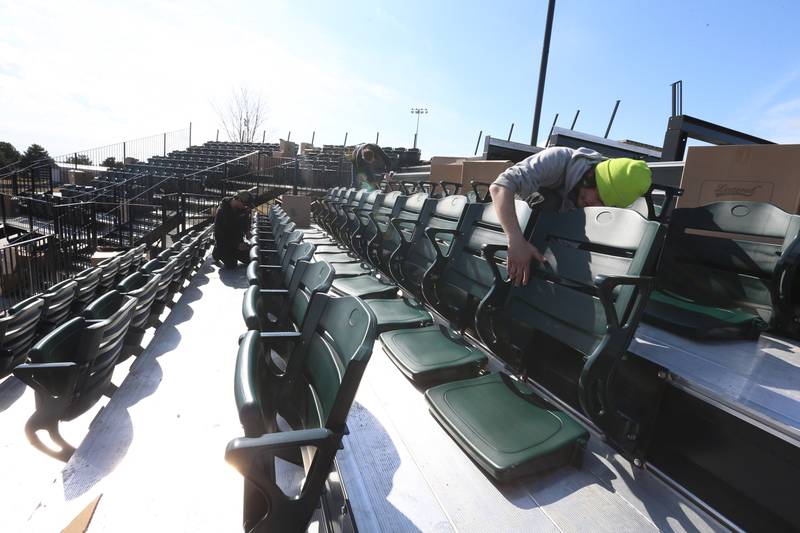 Workers from Hayden Construction installed box seats at Schweickert Stadium on Monday, March 6, 2023 in Peru. The stadium home of the Pistol Shrimp grandstand was approved by the Peru City Council last June. This phase included 575 box seats, a new grandstand and press box.